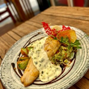 Zander in cream sauce with rice and vegetables
