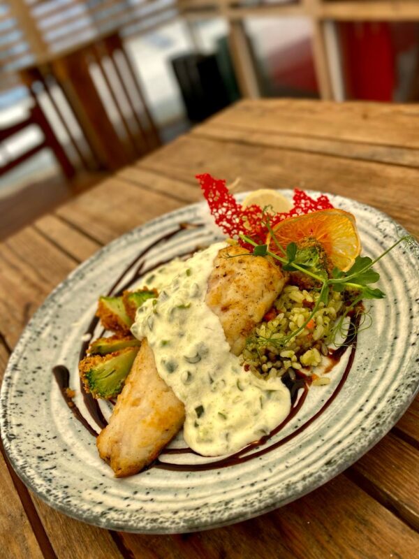 Zander in cream sauce with rice and vegetables