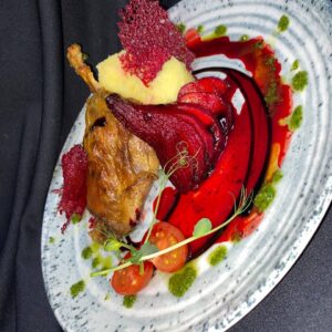 Duck's leg with marinated pear